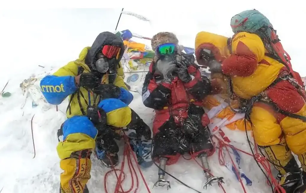 Hari Budha Magar (center) reaches Mt. Everest summit &ndash; courtesy of Shanta Nepali Productions 