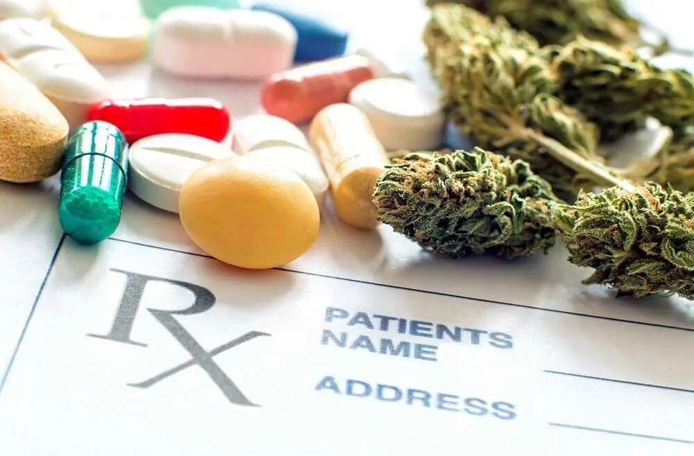 Close up of prescription pills with medical cannabis and prescription paper