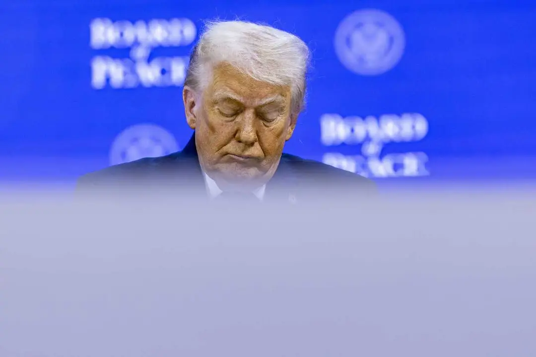 HANDOUT - 22 January 2026, Switzerland, Davos: US President Donald Trump attends the 'Board of Peace' initative at the World Economic Forum Annual Meeting in Davos. Photo: Benedikt von Loebell/World Economic Forum/dpa - ATTENTION: editorial use only and o