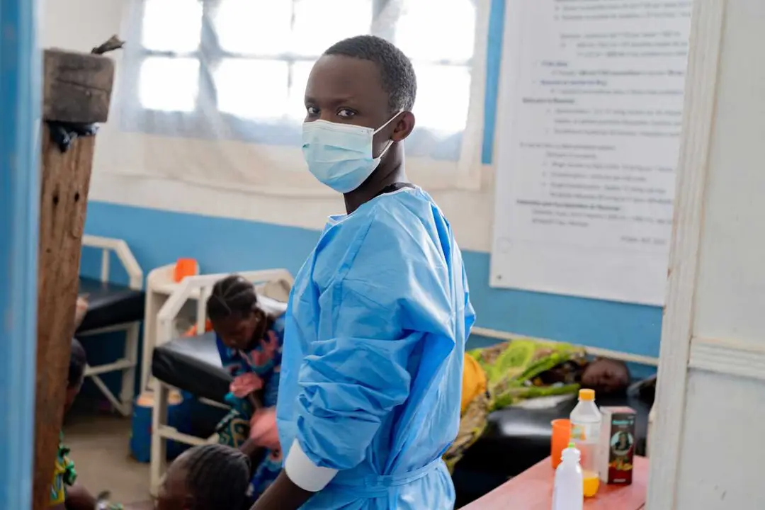 BEIJING, May 17, 2026  -- A health worker wearing a mask is seen at the general reference hospital in Rwampara in eastern Democratic Republic of the Congo, on May 16, 2026.