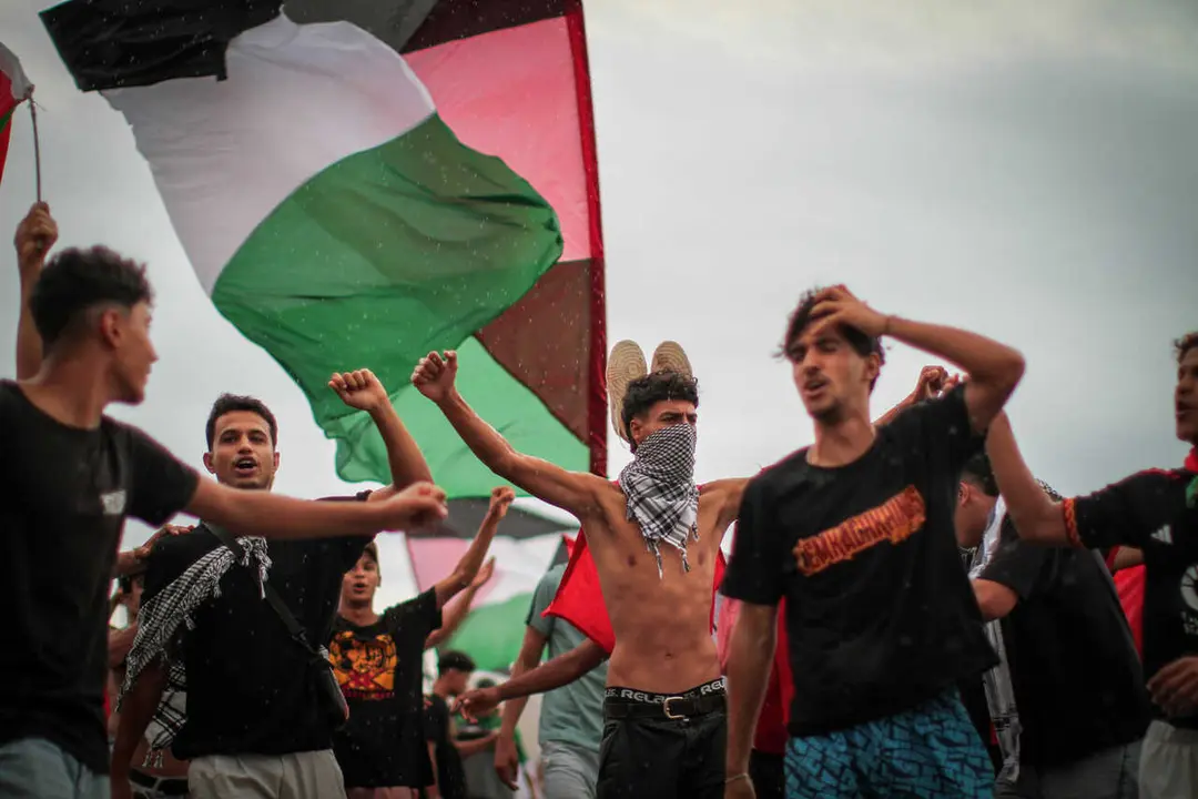 Supporters and activists of the Global Sumud Flotilla gather at the Tunisian port of Sidi Bou Said, ahead of the scheduled departure to the Gaza Strip to break Israel's blockade on the Palestinian territory on September 10, 2025. Organisers of the flotilla named 'Sumud', an Arabic word meaning steadfastness, which carries aid and pro-Palestinian activists, said late September 9 that another of their boats had been struck in a suspected drone attack off Tunisia's coast, adding the flotilla was due to resume its voyage on September 10 after multiple delays.