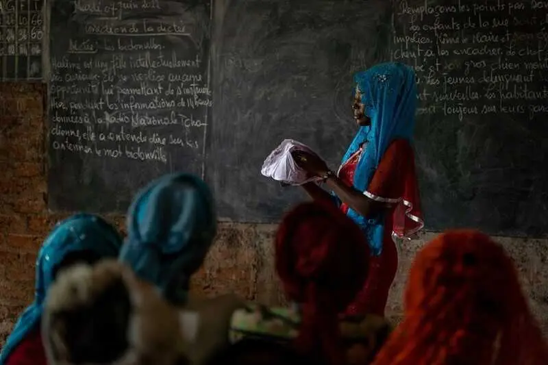 Demonstration on how to use MHM kits  done by teachers and a the president, Hadje Abdelaziz, of the Girls Club at Gondje school in Gondje camp for CAR refugees, Nya-Pende province, southern Chad. The consortium JRS_ACRA_CELIAF with UNICEF and ECW funds implements an MHM project to enhance girls education. Credits to Irene Galera