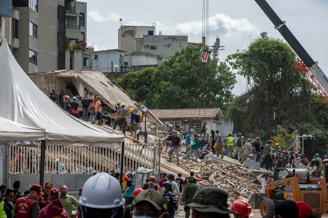 June 25, 2026, Caracas, Miranda, Venezuela: Rescue workers search through the rubble looking for survivors after an earthquake. Two powerful earthquakes measuring 7.2 and 7.5 struck Venezuela on the evening of 24 June, causing at least 500 casualties and over 600 injuries, dozens of buildings destroyed. (Credit Image: � Jimmy Villalta/ZUMA Press Wire)