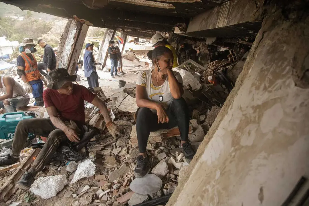 EDITOR'S NOTE: These images contain graphic content, including deceased victims. Viewer discretion is advised. CARABALLEDA, LA GUAIRA, VENEZUELA &ndash; JULY 5, 2026: Rescue and recovery teams continue recovering the bodies of victims from beneath the rubble of collapsed buildings in Caraballeda, La Guaira state, following the devastating earthquakes that struck Venezuela's Caribbean coast. Emergency personnel are continuing search and recovery operations across the affected areas as authorities report more than 3,340 fatalities and over 16,470 injuries, with additional victims still believed to be trapped beneath the debris. Photo by Laura De Chiclana / JNA PRESS. (Photo by Laura de Chiclana/JNA Press via Nexpher Images)