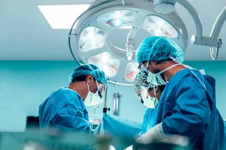 Team of Surgeons Operating in the Hospital.