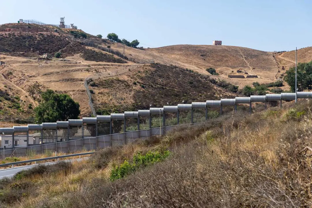 CEUTA, SPAIN &ndash; AUGUST 10, 2026: The border fence surrounding the Spanish autonomous city of Ceuta is seen alongside facilities belonging to Morocco&rsquo;s Royal Gendarmerie on the Moroccan side of the frontier. Moroccan security forces monitor the border and respond to attempts by migrants to enter Ceuta irregularly. The area remains one of the main security points along the land border between Morocco and Spain. Photo by Antonio Sempere / JNA Press.