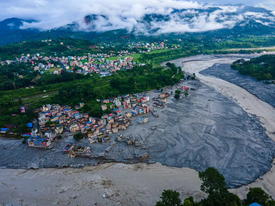 TOP PICS - Nuwakot, Nepal - August 28, 2026: An aerial view shows the aftermath of massive flooding along the Bhotekoshi River, which affected low-lying areas and settlements near the riverbanks in Nuwakot, Nepal. The flooding caused widespread damage to homes, roads, bridge, hydropower station and other infrastructure in the area. Several people remain missing as the number of casualties continues to develop. Rescue teams and security personnel are carrying out search and rescue operations in the affected areas. (Photo by AP Tolang/Nexpher Images)