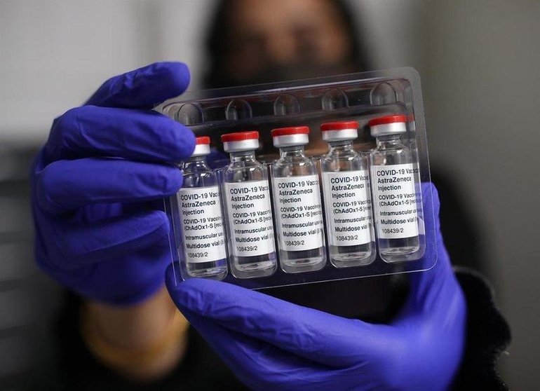  Pharmacist Asha Fowells holds vials of the Oxford-AstraZeneca coronavirus vaccine at Copes Pharmacy 