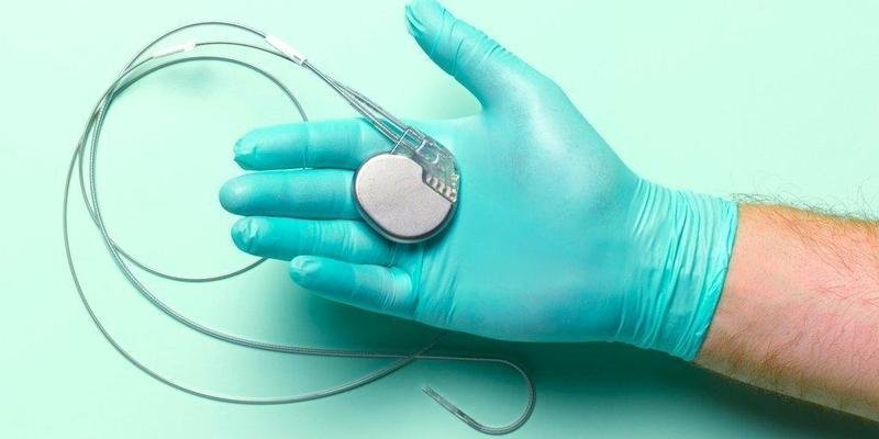 Heart pacemaker in cardiologist's hand