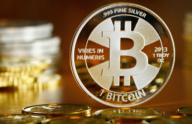 <p> FILED - 28 November 2013, Berlin: A general view of a coin bearing the logo of the Bitcoin cryptocurrency at a coin store. The value of Bitcoin fell below 40,000 dollars on Monday for the first time since September. Photo: Jens Kalaene/zb/dpa - Jens Kalaene/zb/dpa </p>