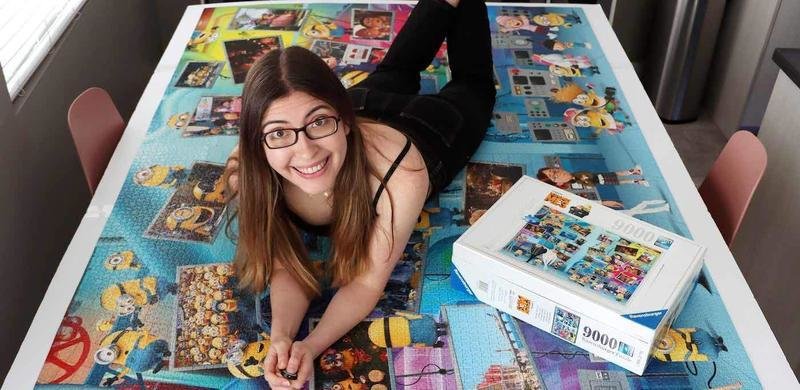  Professional puzzle Karen Kavett. See SWNS story SWSMpuzzle; Meet the professional puzzler who competes in jigsaw championships and can complete a 500-piece puzzle in just 50 minutes – and even place pieces with her feet. Karen Kavett, 31, has always loved puzzles and made her hobby her job after sharing videos of her completing them in June 2018. She likes to try her hand at jigsaws with a twist - such as gradient and patterned puzzles - and has even completed one with her feet. Karen took part in the National Jigsaw Puzzle Championships in San Diego, California, US, in October 2022. She finished in second place in the individual competition with a time of 50 minutes to complete a 500-piece puzzle.    