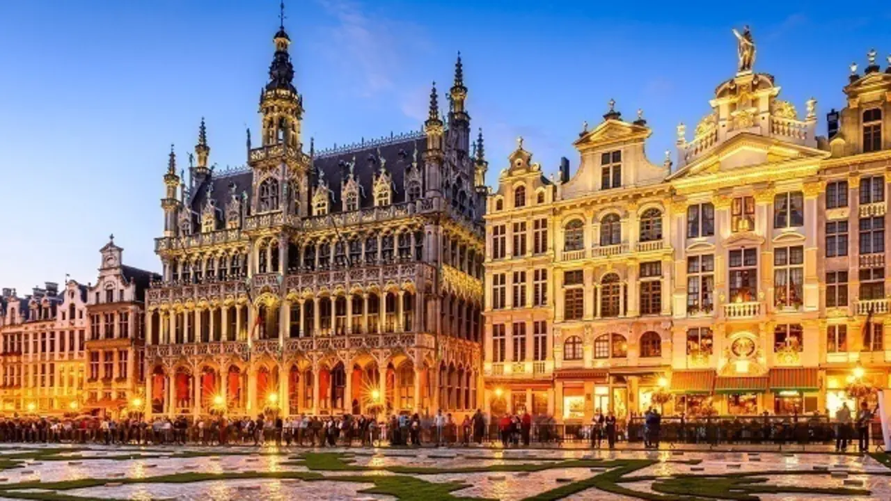 Brussels, Belgium. Wide angle night scene of the Grand Place and Maison du Roi, one of Europe finest historic squares and a must-see sight of Bruxelles.