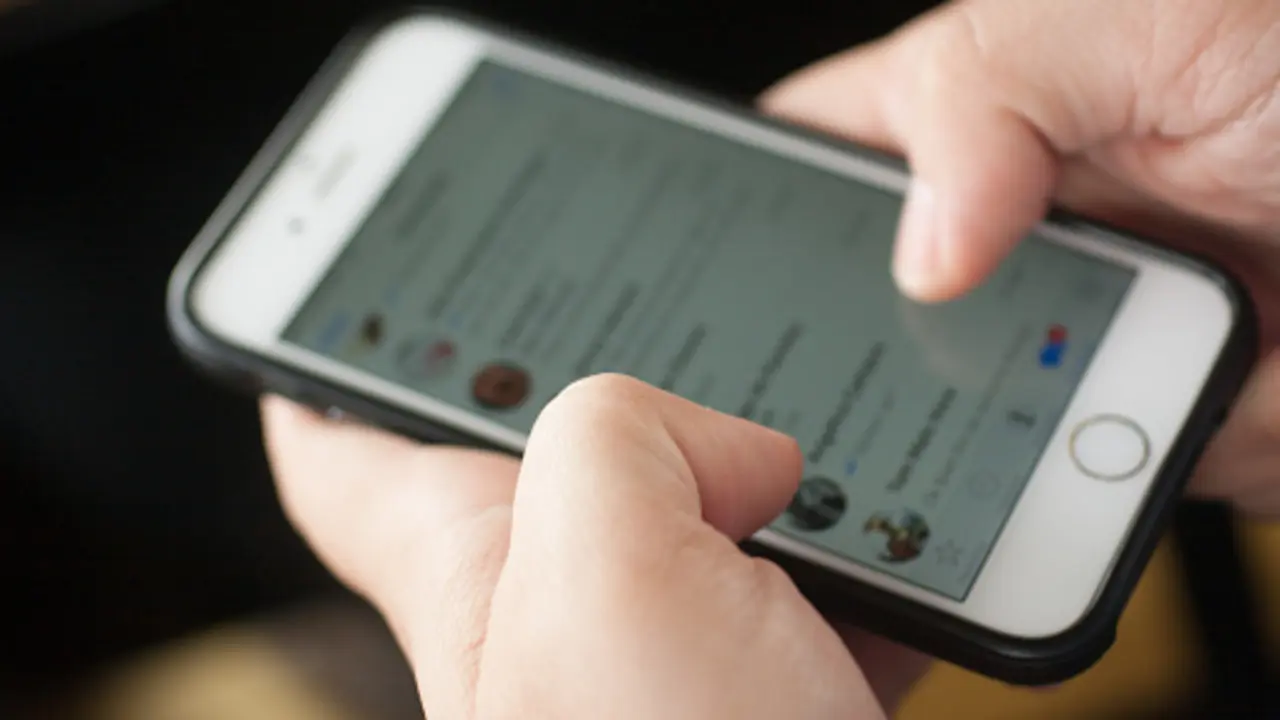 Rio de Janeiro, Brazil - June 4, 2016: Men typing in Whatsapp or text mensage