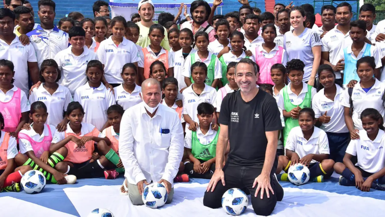 <p> Mr. Youri Djorkaeff, CEO - FIFA Foundation and Dr. Achyuta Samanta, Founder, KIIT & KISS amidst the football trainees during the lunch of FIFA Football for School Programme at KISS - KIIT/PR NEWSWIRE </p>
