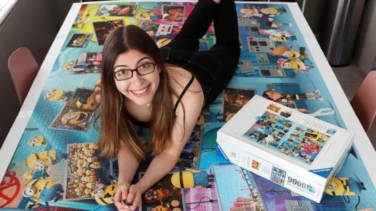  Professional puzzle Karen Kavett. See SWNS story SWSMpuzzle; Meet the professional puzzler who competes in jigsaw championships and can complete a 500-piece puzzle in just 50 minutes &ndash; and even place pieces with her feet. Karen Kavett, 31, has always loved puzzles and made her hobby her job after sharing videos of her completing them in June 2018. She likes to try her hand at jigsaws with a twist - such as gradient and patterned puzzles - and has even completed one with her feet. Karen took part in the National Jigsaw Puzzle Championships in San Diego, California, US, in October 2022. She finished in second place in the individual competition with a time of 50 minutes to complete a 500-piece puzzle.    