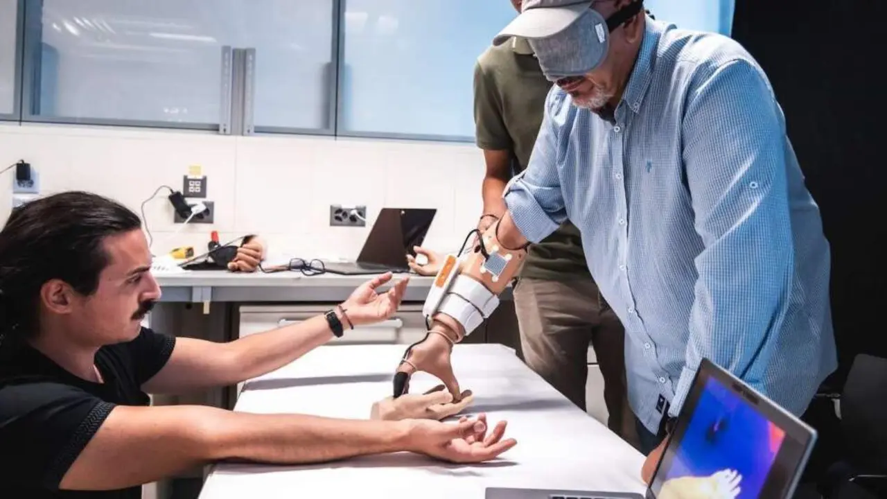  Fabrizio, a 57-year-old man from Pistoia in Italy, trying the first-ever prosthetic limb that allows the wearer to sense temperature. Photo released Februatry 9 2024. See SWNS story SWSCprosthetic. The first-ever prosthetic limb that allows the wearer to sense temperature and feel the warmth of another person has been created.The MiniTouch, a device that allows amputees to perceive and respond to temperature, is hoped to vastly improve their human connections. The smart new device allows amputees to sense temperature by transmitting thermal information from the fingertip of the prosthetic hand to the wearer's residual arm.Using the device, an amputee of more than three decades was able to differentiate between hot and cold objects with 100 per cent accuracy, and even feel the warmth of another person's hand through their prosthetic. 