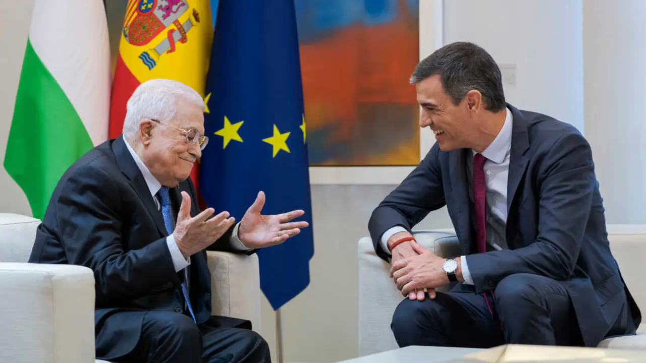 Palestinian President Mahmoud Abbas (L) and Spanish Prime Minister Pedro Sanchez (R) are seen during a meeting at Moncloa Palace in Madrid.