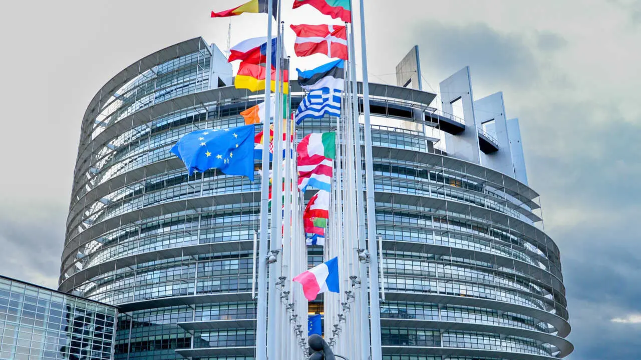 European flags at half-mast in front of the European Parliament building in Strasbourg in honour of former European Commission President Jacques Delors