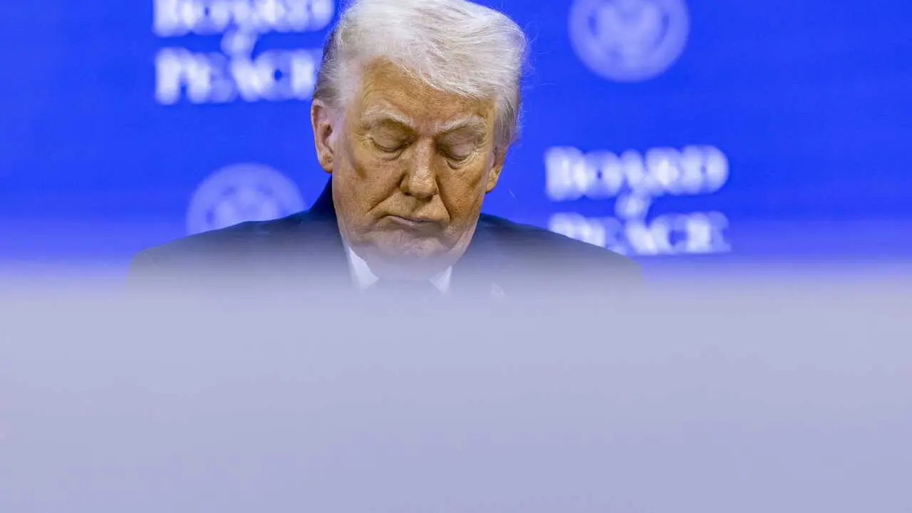 HANDOUT - 22 January 2026, Switzerland, Davos: US President Donald Trump attends the 'Board of Peace' initative at the World Economic Forum Annual Meeting in Davos. Photo: Benedikt von Loebell/World Economic Forum/dpa - ATTENTION: editorial use only and o