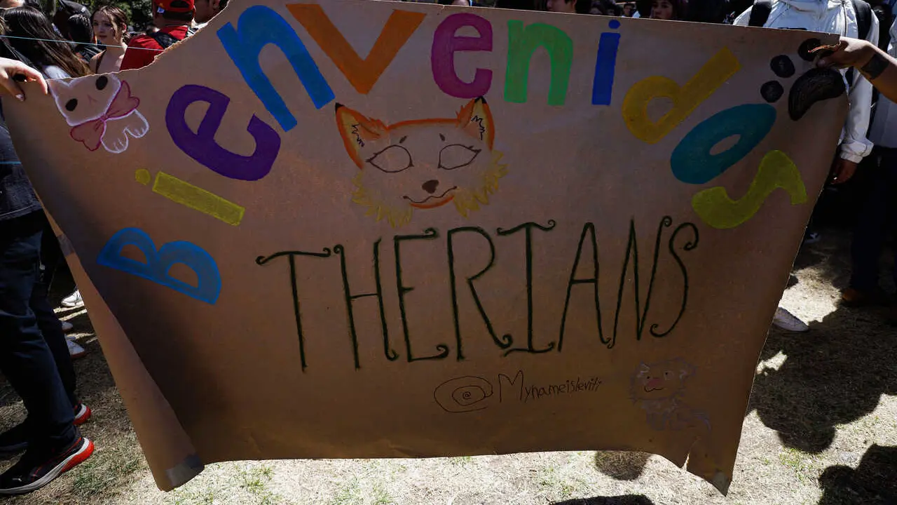 Students hold a placard to welcome Therians to Las Islas at the National Autonomous University of Mexico (UNAM), expressing their feeling of being like animals and ''experiencing a deep, psychological, or spiritual connection with an animal.'' According to the Therian subculture, their activities may include group dynamics, quadrobics (movement on all fours), the use of animal masks and accessories, and spaces for sharing experiences related to this identity.