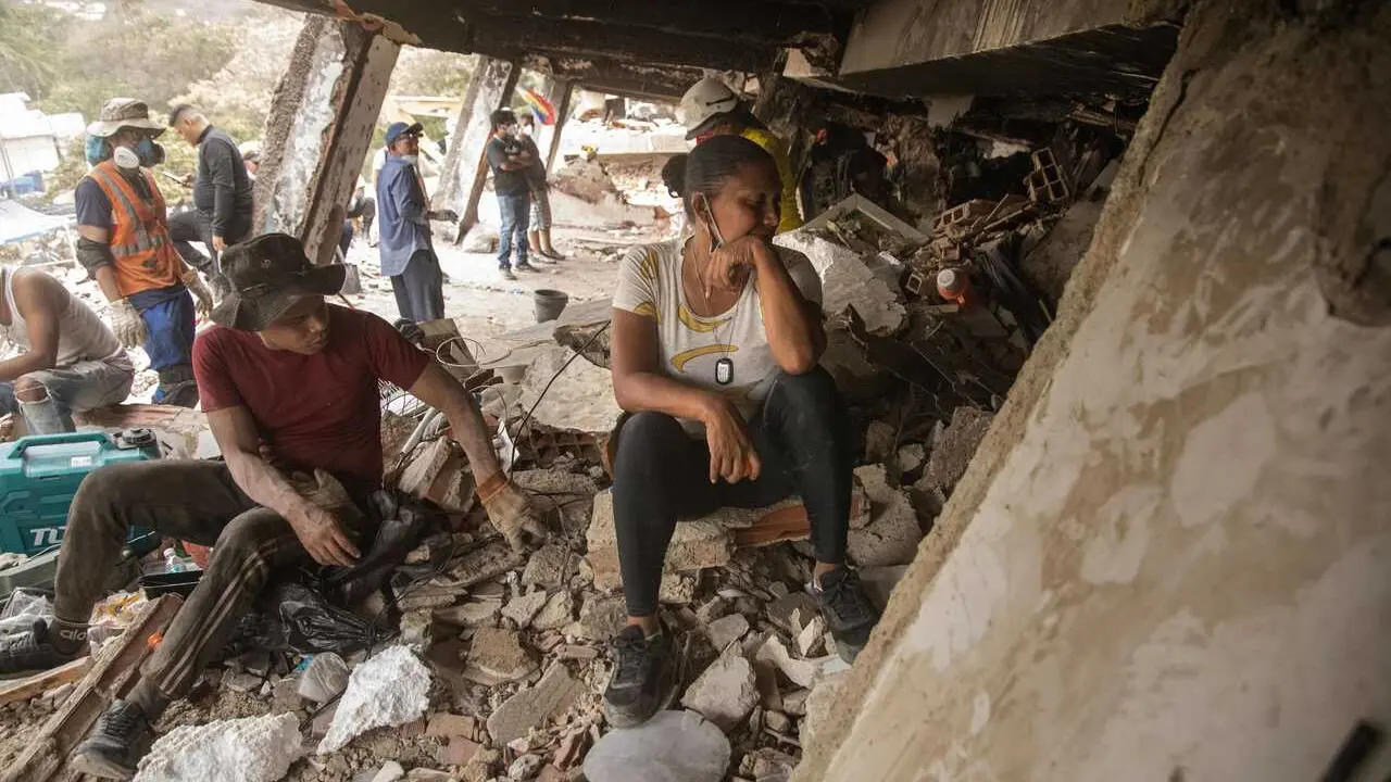 EDITOR'S NOTE: These images contain graphic content, including deceased victims. Viewer discretion is advised. CARABALLEDA, LA GUAIRA, VENEZUELA &ndash; JULY 5, 2026: Rescue and recovery teams continue recovering the bodies of victims from beneath the rubble of collapsed buildings in Caraballeda, La Guaira state, following the devastating earthquakes that struck Venezuela's Caribbean coast. Emergency personnel are continuing search and recovery operations across the affected areas as authorities report more than 3,340 fatalities and over 16,470 injuries, with additional victims still believed to be trapped beneath the debris. Photo by Laura De Chiclana / JNA PRESS. (Photo by Laura de Chiclana/JNA Press via Nexpher Images)