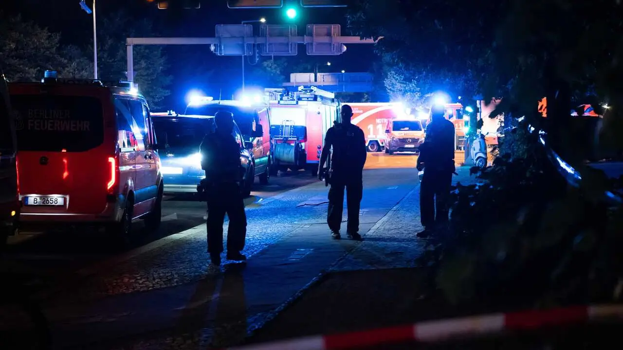 BERLIN, July 26, 2026  -- Police officers work near the site where a car drove into a crowd in Berlin, Germany, July 26, 2026. One person was killed and 16 others were injured, including several with life-threatening injuries, after a car drove into a cro