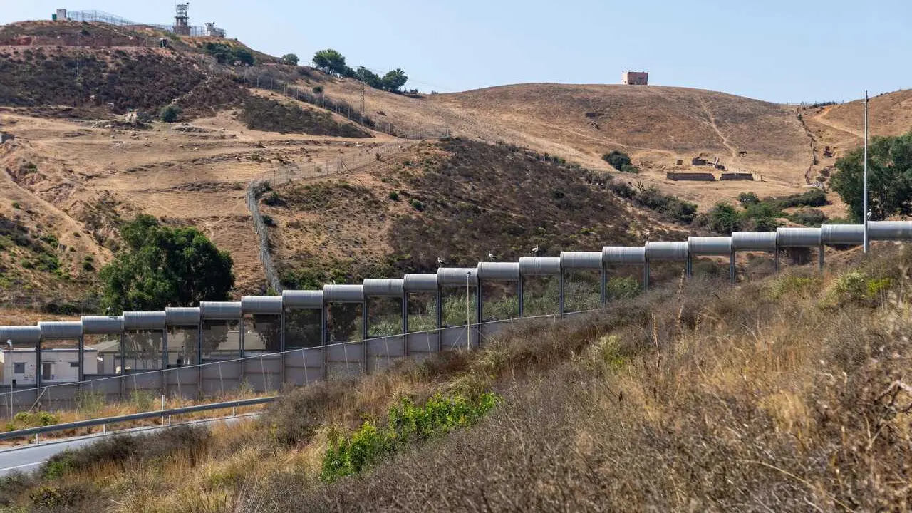 CEUTA, SPAIN &ndash; AUGUST 10, 2026: The border fence surrounding the Spanish autonomous city of Ceuta is seen alongside facilities belonging to Morocco&rsquo;s Royal Gendarmerie on the Moroccan side of the frontier. Moroccan security forces monitor the border and respond to attempts by migrants to enter Ceuta irregularly. The area remains one of the main security points along the land border between Morocco and Spain. Photo by Antonio Sempere / JNA Press.