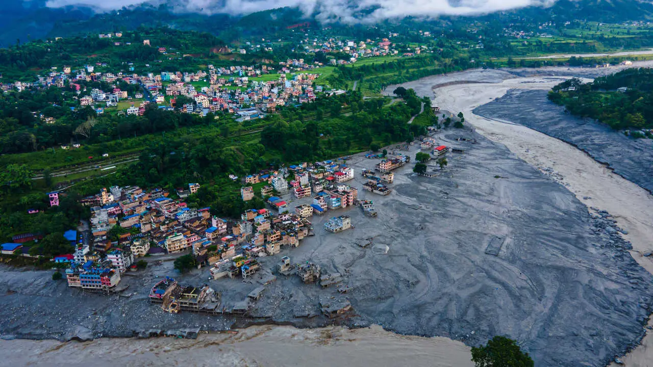 TOP PICS - Nuwakot, Nepal - August 28, 2026: An aerial view shows the aftermath of massive flooding along the Bhotekoshi River, which affected low-lying areas and settlements near the riverbanks in Nuwakot, Nepal. The flooding caused widespread damage to homes, roads, bridge, hydropower station and other infrastructure in the area. Several people remain missing as the number of casualties continues to develop. Rescue teams and security personnel are carrying out search and rescue operations in the affected areas. (Photo by AP Tolang/Nexpher Images)